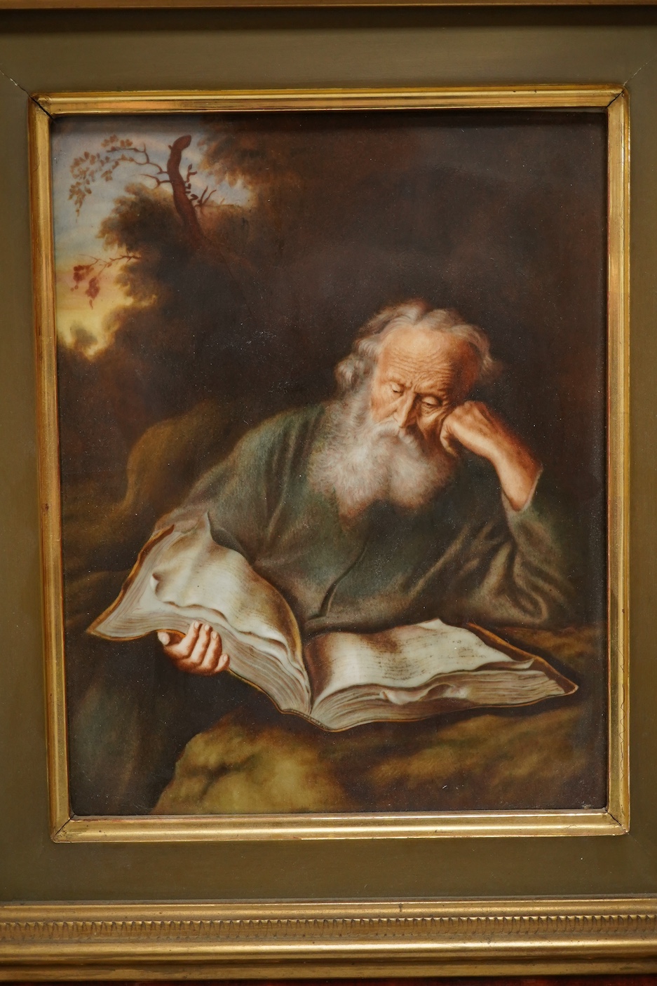 A Rosenthal porcelain plaque, 'The Hermit', housed in an ornate gilt frame, 45cm high overall